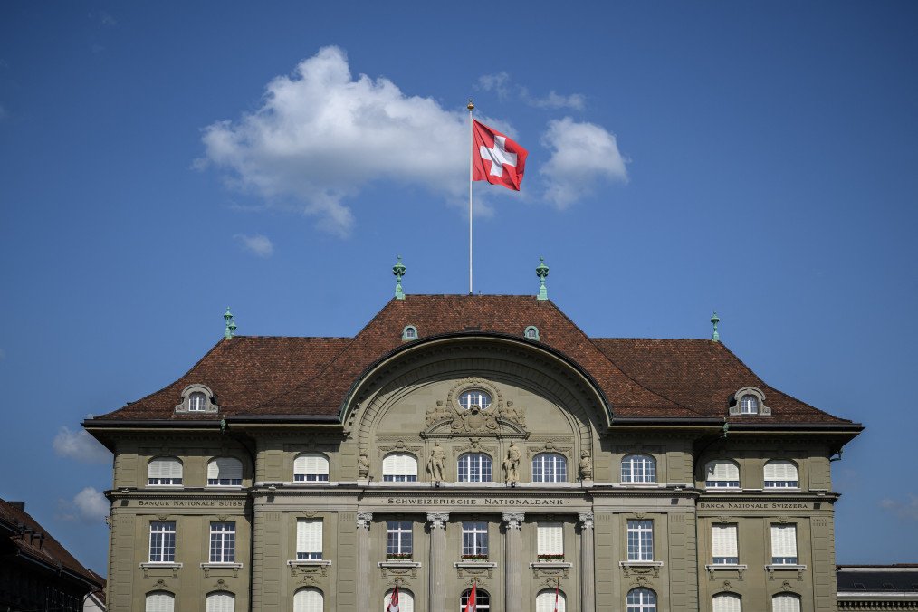 A Swiss national flag flying atop the Swiss National Bank (SNB) building at the Federal Square in Bern. (Source: Getty Images)