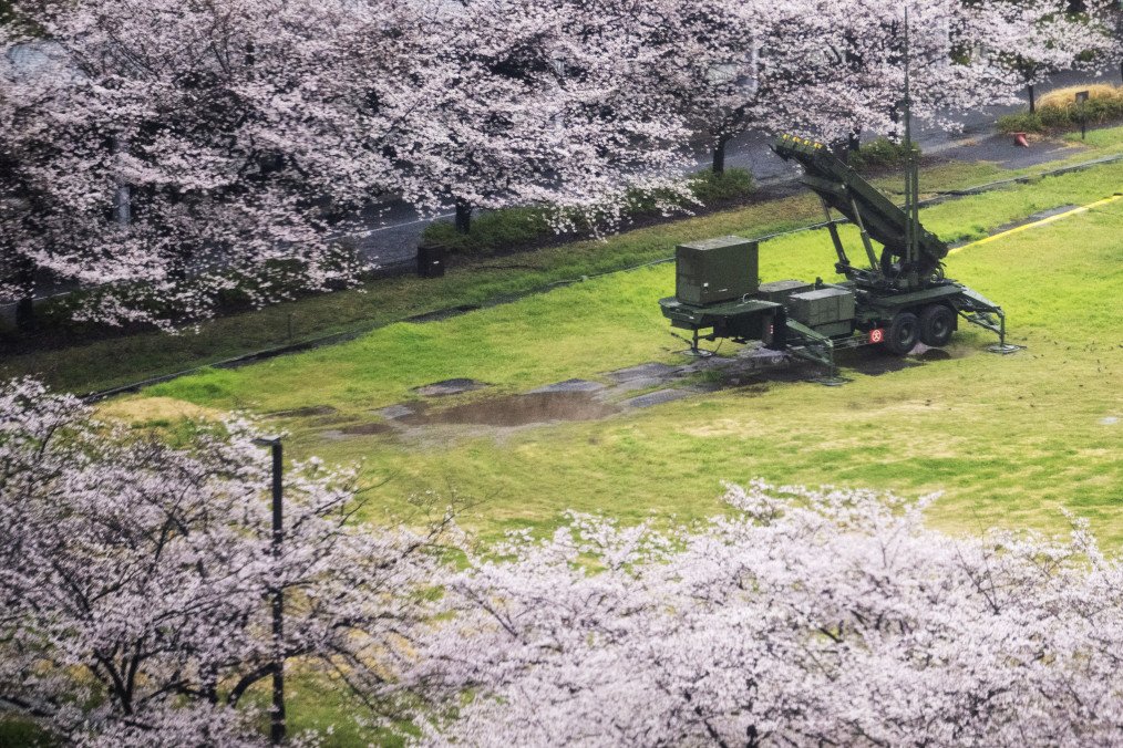 A Patriot Advanced Capability-3 (PAC-3) missile launcher is set next to fully bloomed cherry blossom trees at the Defence Ministry in Tokyo on April 1, 2026. A Patriot Advanced Capability-3 (PAC-3) missile launcher is set next to fully bloomed cherry blossom trees at the Defence Ministry in Tokyo on April 1, 2026.