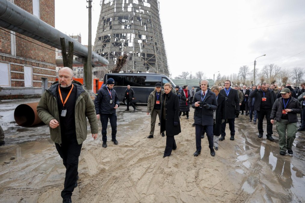 First Deputy PM and Energy Minister of Ukraine Denys Shmyhal leads European allies past a ruined Kyiv CHP plant cooling tower on the invasion’s 4th anniversary. (Source: Denys Shmyhal)