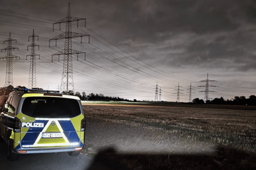 Police vehicles near the power grid infrastructure in Dormagen, North Rhine-Westphalia, during an operation following the discovery of suspicious devices. Police vehicles near the power grid infrastructure in Dormagen, North Rhine-Westphalia, during an operation following the discovery of suspicious devices.