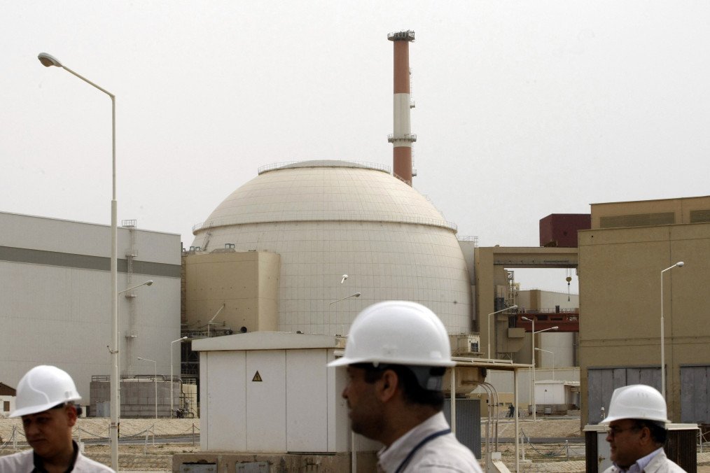 Iranian technicians walk outside the reactor building of the Bushehr nuclear power plant in southern Iran, February 25, 2009. (Source: Getty Images)
