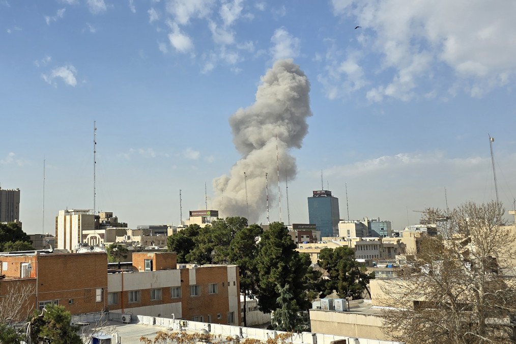 A plume of smoke rises over Tehran following an explosion on February 28, 2026, after Israel announced it had launched a preemptive strike against Iran. (Source: Getty Images)