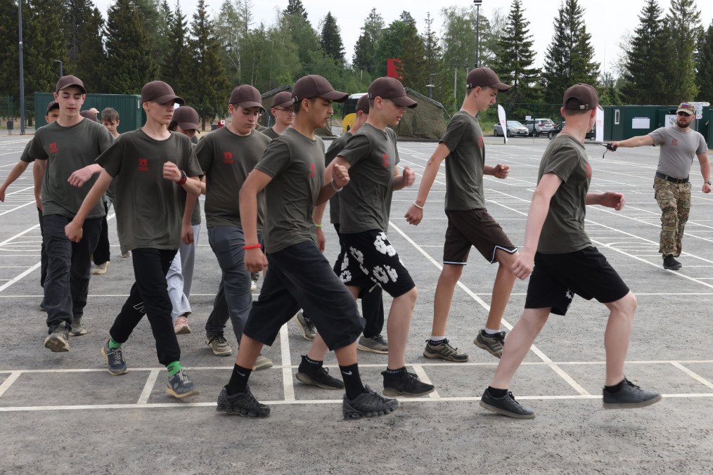 Russian Lawmaker Pushes Plan to Put Combat Veterans in Classrooms A Russian Federal Border Service officer looks at schoolchildren marching on the parade ground during drill training at the Zhukov Camp, June 6, 2025. (Source: Getty Images)