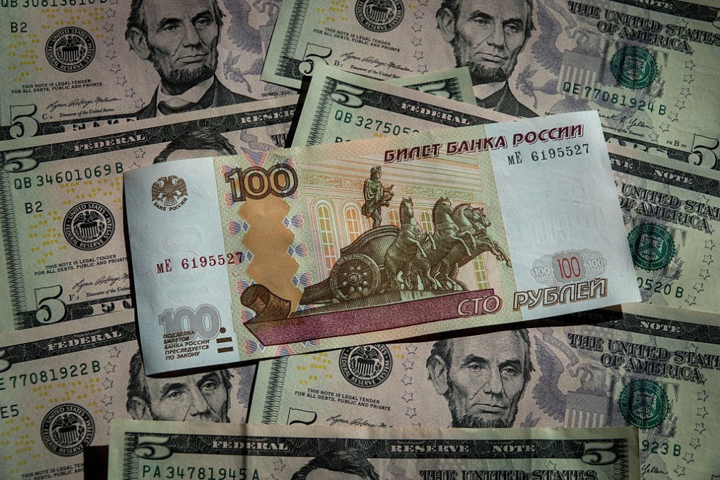 Russian rouble banknotes are seen besides a five Dollar bill notes on March 14, 2026 in Bath, England. (Source: Getty Images) Russian rouble banknotes are seen besides a five Dollar bill notes on March 14, 2026 in Bath, England. (Source: Getty Images)
