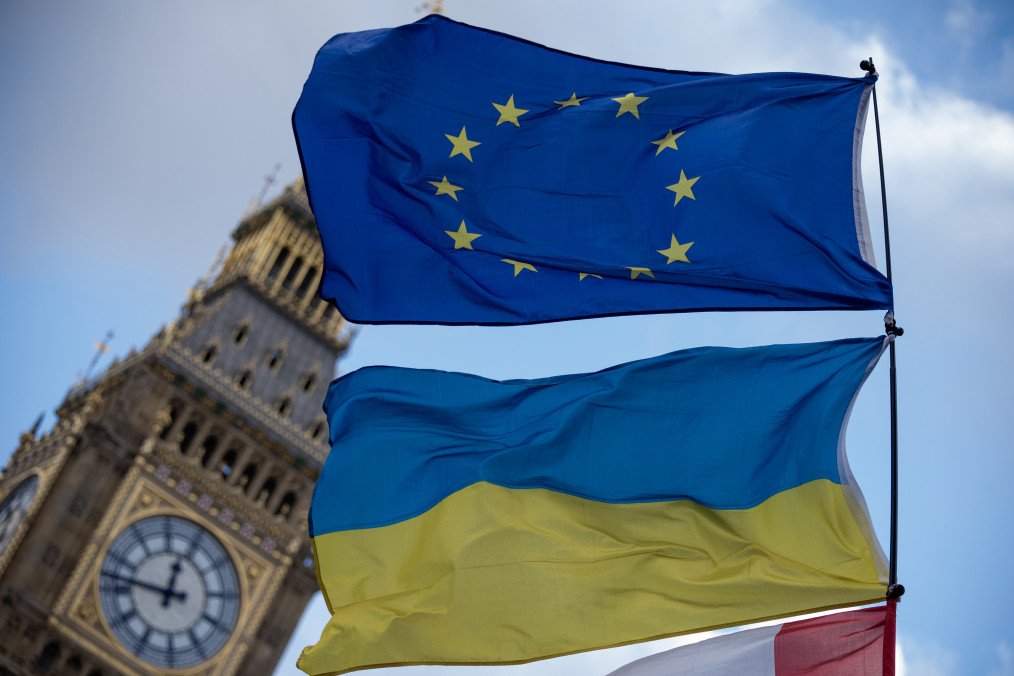 View of the European Union flag and a Ukrainian flag flying in front of the Big Ben during the demonstration at the Parliament Square. (Source: Getty Images)