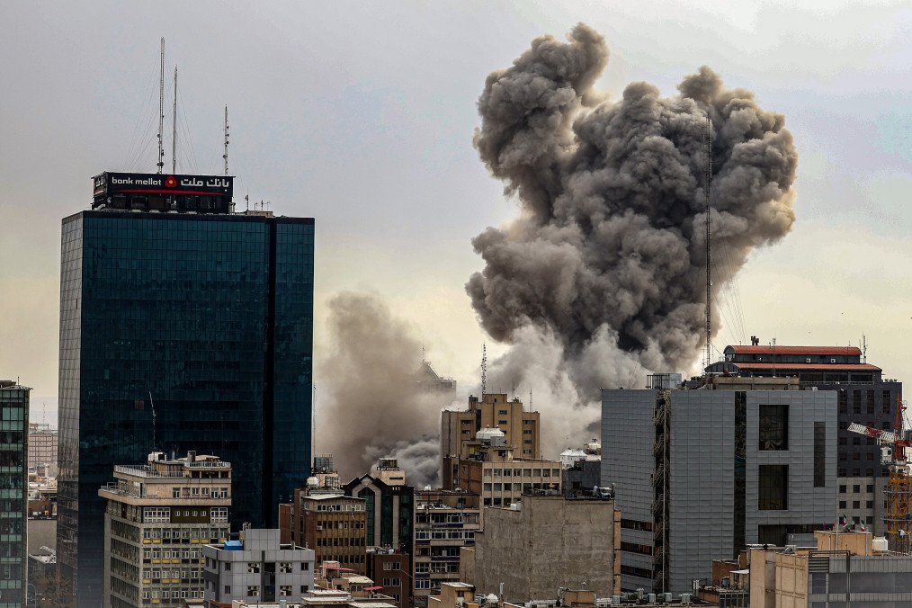 Tehran skyline with smoke rising in the distance following reported explosions during US and Israeli strikes, March 2, 2026. (Source: Getty Images)