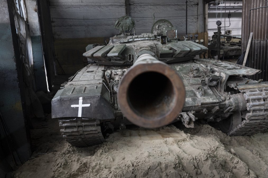 A captured Russian T-72B3 tank awaits repairs on February 13, 2023, at a warehouse in eastern Ukraine. (Source: Getty Images)