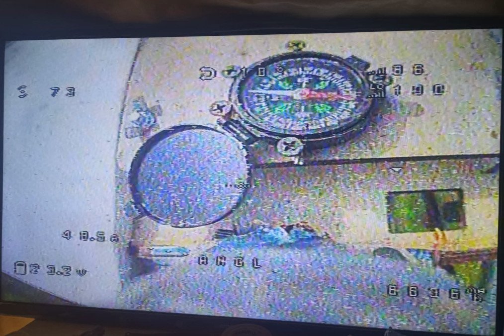A first-person view from a Russian Molniya drone shows a magnetic compass mounted inside the airframe—a surprisingly analog backup to modern drone navigation. (Source: Serhii "Flash" Beskrestnov/Telegram) A first-person view from a Russian Molniya drone shows a magnetic compass mounted inside the airframe—a surprisingly analog backup to modern drone navigation. (Source: Serhii "Flash" Beskrestnov/Telegram)
