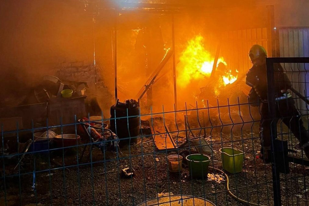 Fire breaks out in a non-residential outbuilding and a private residential home after Russian shelling in the Shevchenkivskyi district, in Kyiv, Ukraine on October 15, 2026. (Source: State Emergency Service/Getty Images)