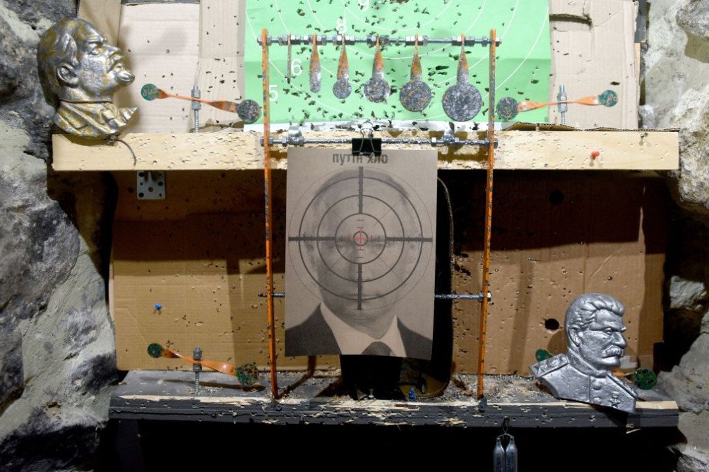 A photograph shows a target with bullet holes, depicting Russian leader Vladimir Putin, in a shooting range in the western Ukrainian city of Lviv, on February 18, 2022. (Source: Getty Images)