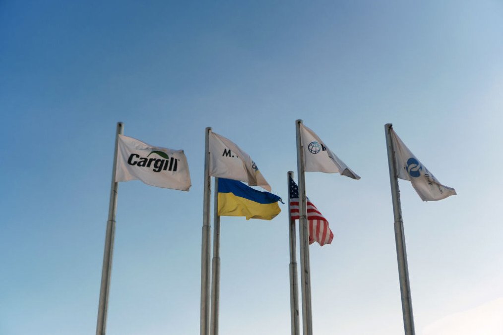 The flags of funding companies sit alongside those of Ukraine and United States in the grain terminal, operated by Cargill Inc. and M.V. Cargo, at Yuzhny Port in Yuzhny, Ukraine. (Source: Getty Images)