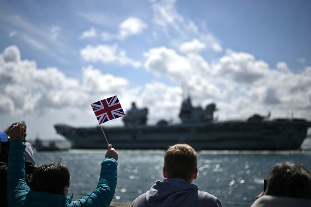 British aircraft carrier HMS Prince of Wales leaves Portsmouth Naval Base on the south coast of England on April 22, 2025, for deployment to the Indo-Pacific region. (Source: Getty Images)