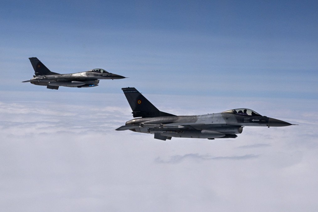 Romanian Air Force F-16 fighter jets participate in a NATO Air Policing exercise over Allied airspace, July 4, 2023. (Source: Getty Images)