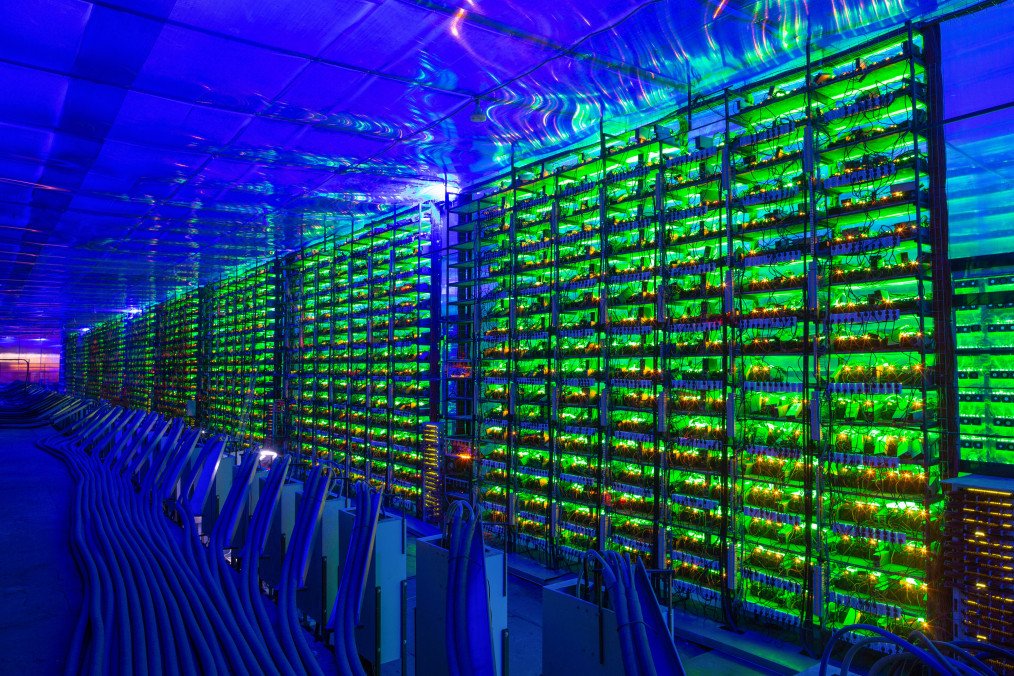 Power Crisis Forces Russia to Abandon 38 Data Center Builds Worth $2.2B Illuminated mining rigs operate inside racks at the CryptoUniverse cryptocurrency mining farm in Nadvoitsy, Russia. (Source: Getty Images)