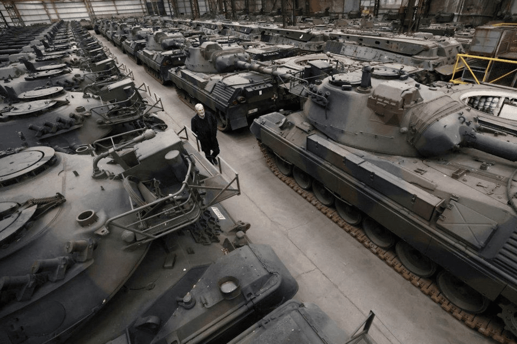 Rows of Leopard 2A4 main battle tanks undergo refurbishment at Rheinmetall’s facility in Unterlüß, Germany, before delivery to Ukraine. (Source: Rheinmetall)
