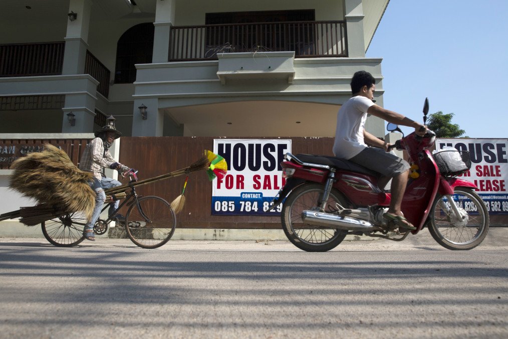 A motorcyclist and a cyclist ride past “House For Sale” signs in Koh Samui, Surat Thani province, Thailand, on Thursday, January 18, 2018. (Source: Getty Images) A motorcyclist and a cyclist ride past “House For Sale” signs in Koh Samui, Surat Thani province, Thailand, on Thursday, January 18, 2018. (Source: Getty Images)