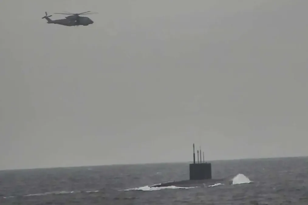 Russia Flexes Naval Muscle Near UK as Submarine Surfaces in Broad Daylight Russia Flexes Naval Muscle Near UK as Submarine Surfaces in Broad Daylight