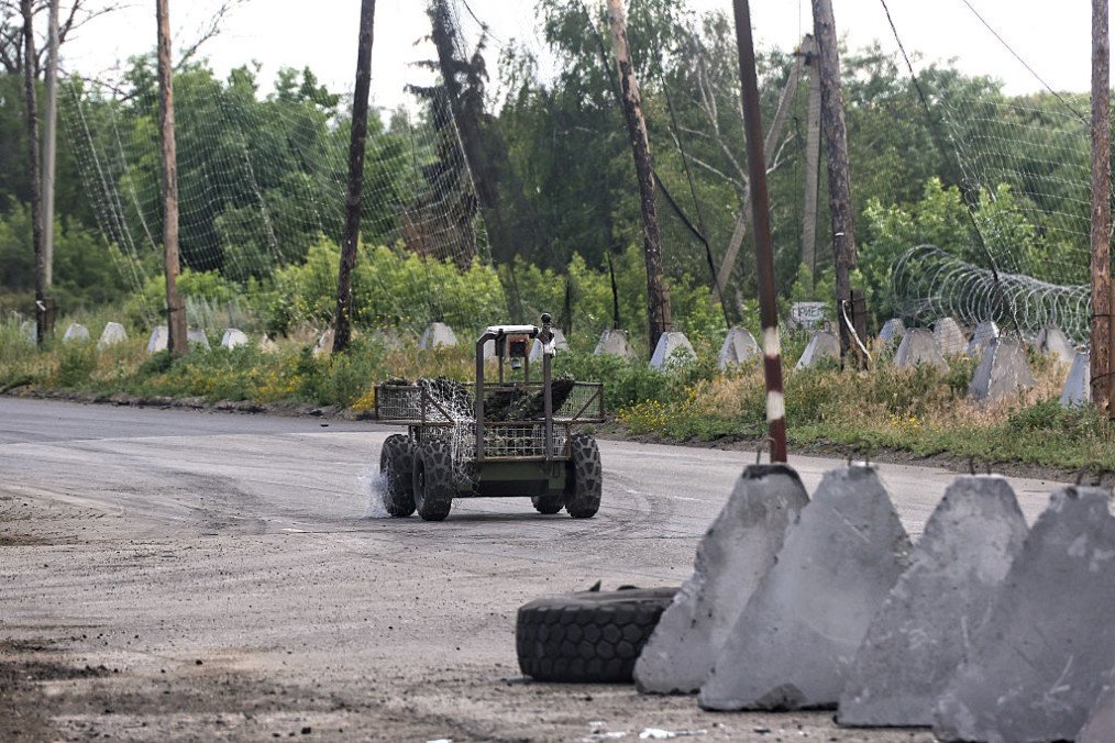 A ground drone travels along a road protected by anti-drone nets in Donetsk region, Ukraine, on June 20, 2026. (Source: Getty Images) A ground drone travels along a road protected by anti-drone nets in Donetsk region, Ukraine, on June 20, 2026. (Source: Getty Images)