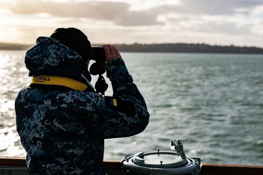 A Ukrainian sailor scans the Solent through binoculars during Exercise Lion Protector off England’s southern coast. (Source: Royal Navy) A Ukrainian sailor scans the Solent through binoculars during Exercise Lion Protector off England’s southern coast. (Source: Royal Navy)