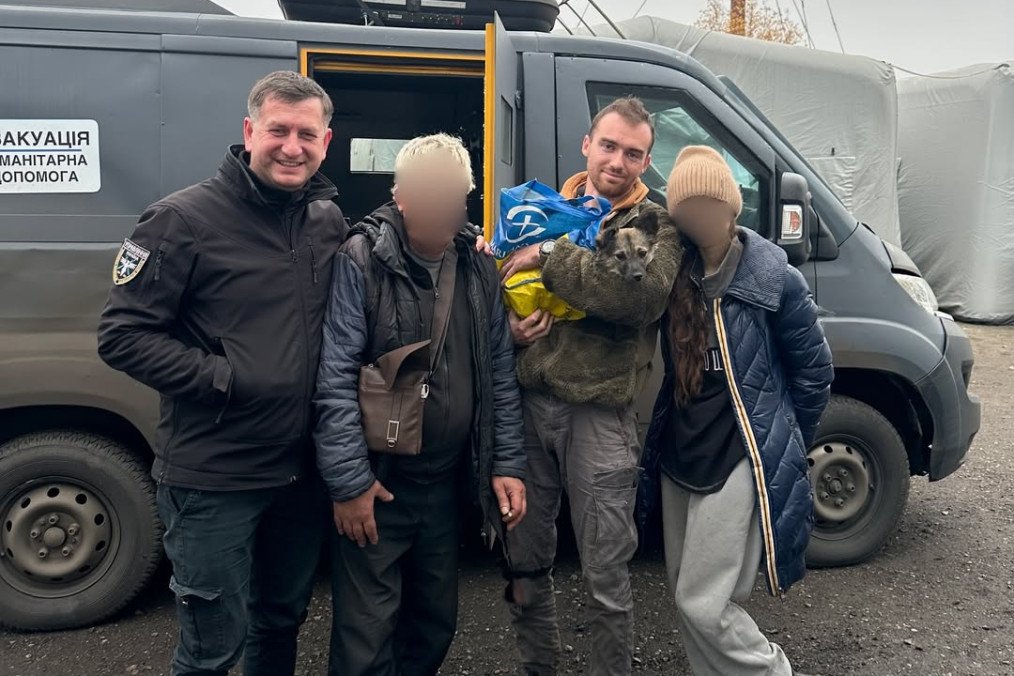 Evacuation volunteers stand with two residents and their dog after safely bringing them out of a frontline area in Donetsk on November 12, 2025. (Source: Diana Yakovleva/Instagram)