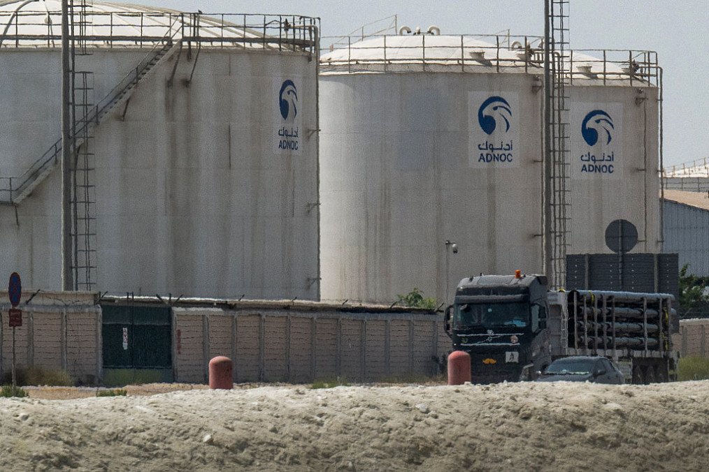 A truck drives past an ADNOC Gas a subsidiary of the Abu Dhabi National Oil Company facility in Abu Dhabi on March 3, 2026. (Source: Getty Images)