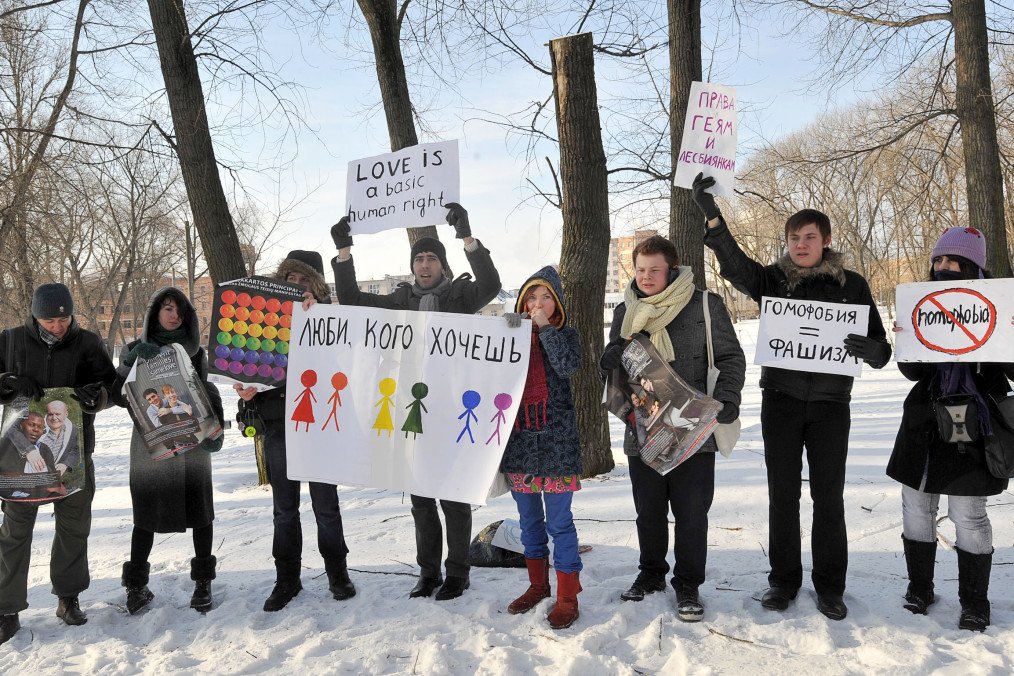 LGBTQ-rights activists hold placards on February 14, 2011 during a rally against homophobia in Minsk, Belarus. (Source: Getty Images)