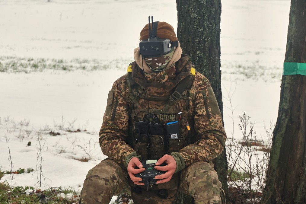 A soldier from the 13th Khartiia Brigade of Ukraine’s National Guard wears a headset to fly an FPV drone during the tests of the net gun used to combat FPV-type UAVs in Ukraine, on January 7, 2026.