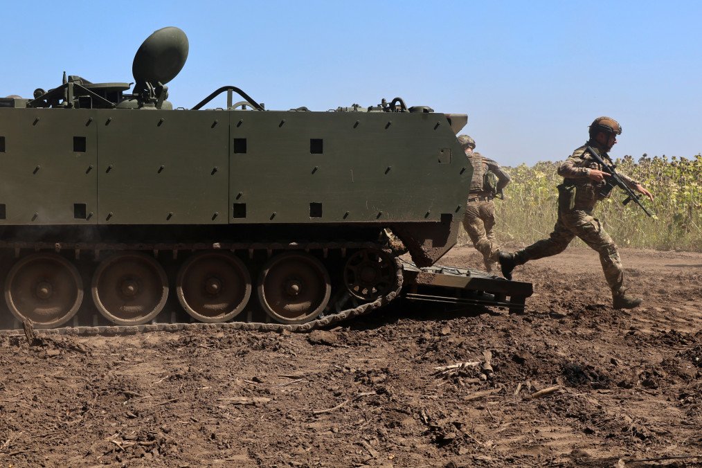 Infantrymen of the operational battalion of the 13th Brigade of the National Guard of Ukraine practice airborne skills using an American M113 tracked armored personnel carrier in the Kharkiv region, Ukraine, on August 29, 2025. (Source: Getty Images)