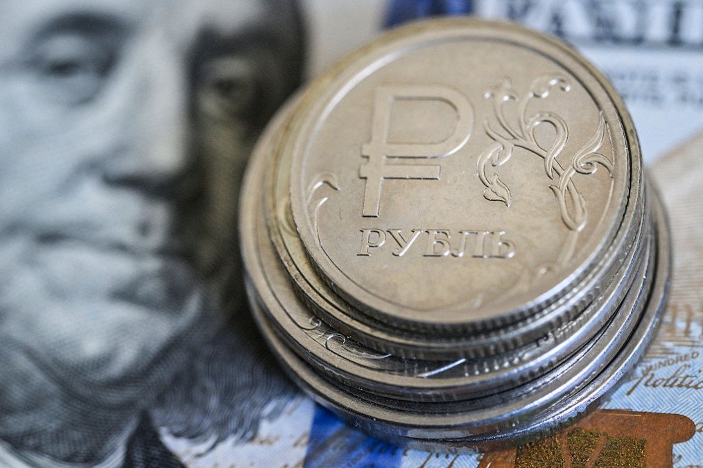 Russian ruble coins on a US dollar note. Illustrative image. (Source: Getty Images)