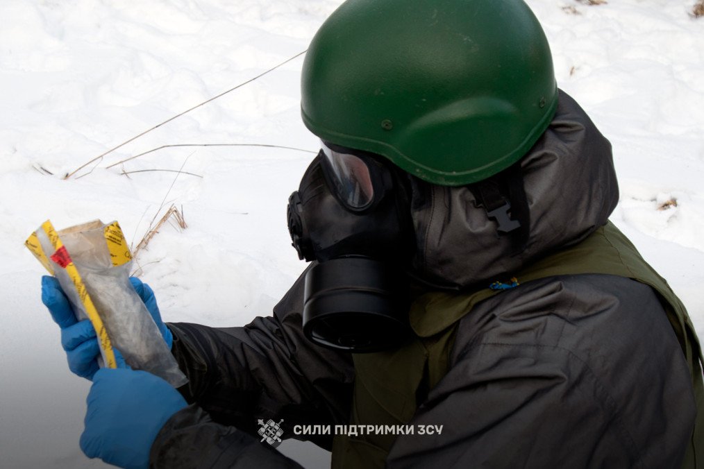 Ukraine Reports Over 13,000 Cases of Russian Chemical Agent Use Since 2022 A serviceman in protective equipment analyzes a suspected chemical agent sample collected from the field. (Source: Public Affairs Officer of the Command of the Support Forces Lt. Col. Maksym Kravchuk)