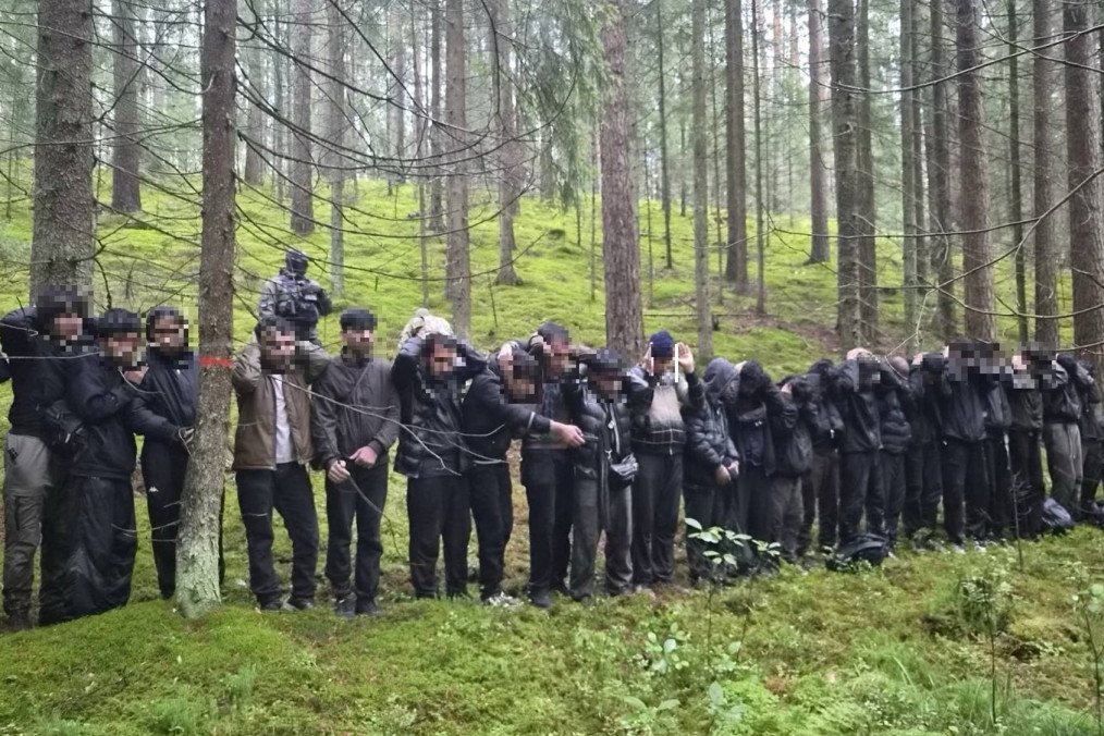 A group of 28 people detained by Latvian border guards after illegally crossing from Belarus into Latvia through an underground tunnel. (Source: Delfi) A group of 28 people detained by Latvian border guards after illegally crossing from Belarus into Latvia through an underground tunnel. (Source: Delfi)