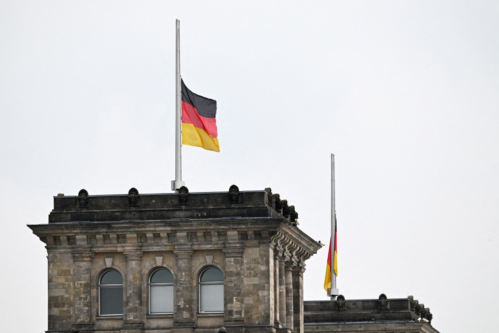 Germany Expels Hundreds of Russians as Covert Embassy Operations Unravel German flags on the Reichstag building. (Source: Getty Images)