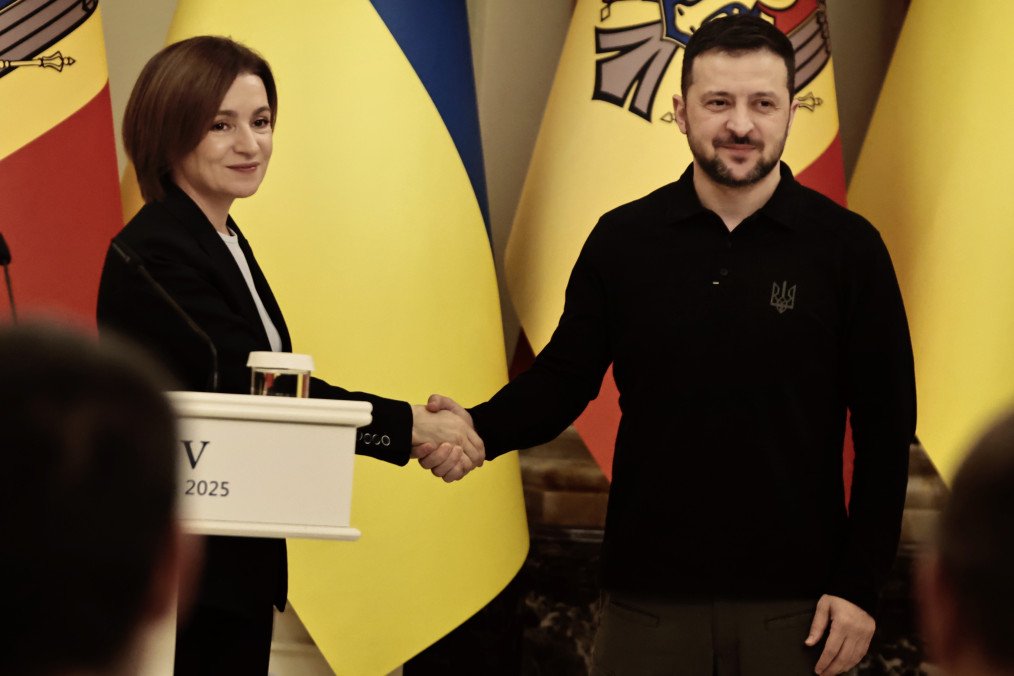 Moldovan President Maia Sandu and Ukrainian President Volodymyr Zelenskyy shake hands during a joint press conference in Kyiv, January 25, 2025. (Source: Getty Images)