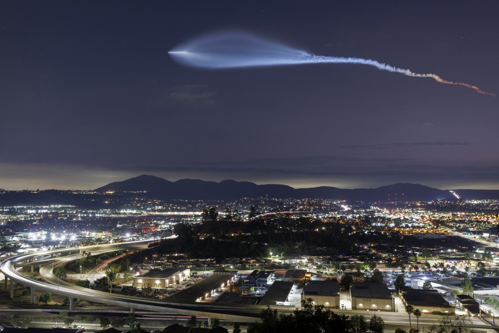 Illustrative image. A SpaceX Falcon 9 rocket carrying a payload of 24 Starlink internet satellites soars into space after launching from Vandenberg Space Force Base on July 18, 2025, seen from Santee, California. (Source: Getty Images)