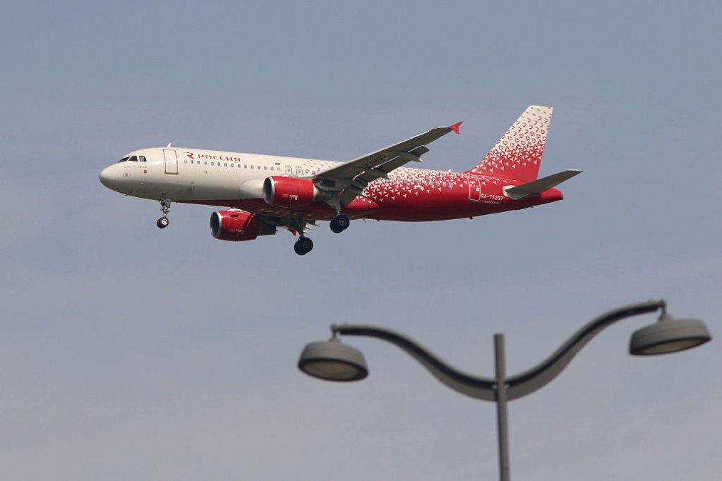 An Airbus A320-214 aircraft operated by Russia – Russian Airlines (Aeroflot Group) is seen in the sky above Pulkovo Airport. (Source: Getty Images)
