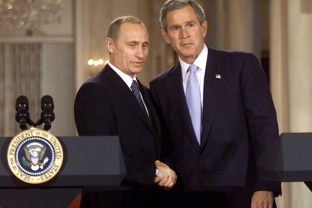 President George W. Bush and Russian leader Vladimir Putin shake hands after speaking with the media in the East Room of the White House November 13, 2001 in Washington, DC. (Source: Getty Images)
