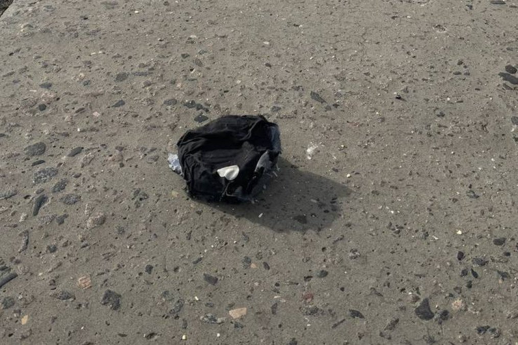 A disguised mine lying on a roadway in Kherson. (Source: Kherson City Military Administration)