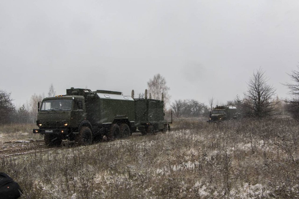 Russian R-330Zh “Zhitel” electronic warfare system mounted on a KamAZ military truck moving through a field during a deployment exercise. (Photo: Open sources)