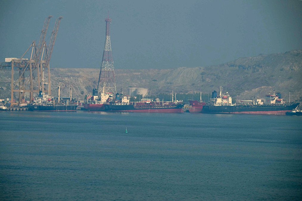 Tankers are seen at the Khor Fakkan Container Terminal, the only natural deep-sea port in the region and one of the major container ports in the Sharjah Emirate, along the Strait of Hormuz. (Source: Getty Images)