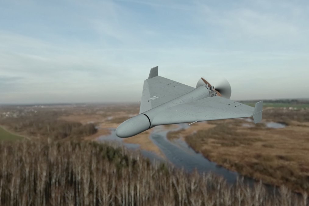 Military drone in the sky over forest and river. (Source: Getty Images)