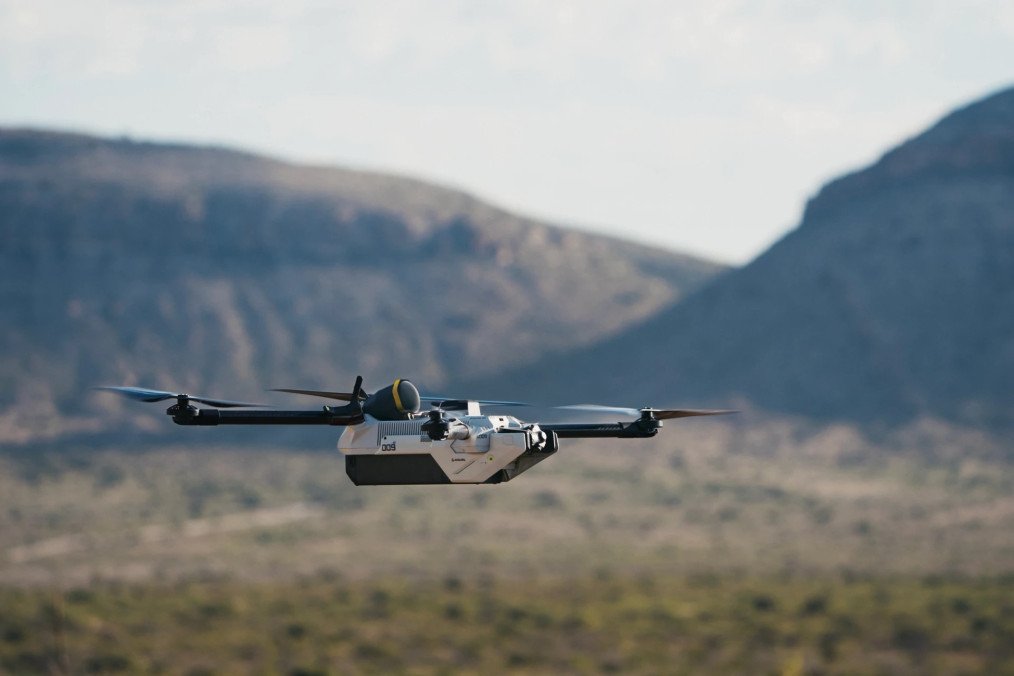 Anduril’s Bolt-M FPV drone in flight during a field test, with mountainous terrain in the background. (Photo: Anduril Industries)