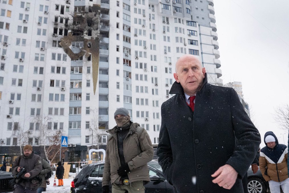 British Defense Secretary John Healey meets with emergency workers at the site of a Russian drone strike in Kyiv on January 9, 2026. (Source: Getty Images)