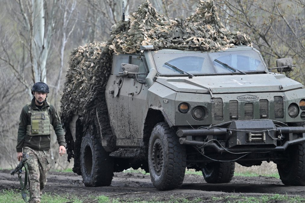 A Ukrainian serviceman stands as a Novator armored vehicle passes near Bakhmut, Donetsk region, on April 8, 2023. (Source: Getty Images) A Ukrainian serviceman stands as a Novator armored vehicle passes near Bakhmut, Donetsk region, on April 8, 2023. (Source: Getty Images)
