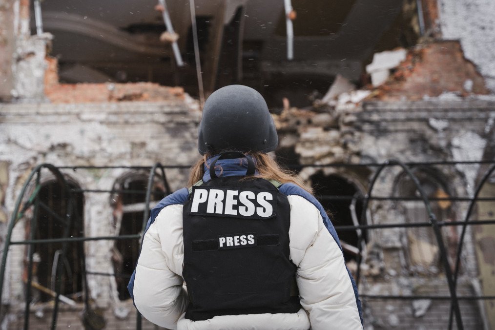 A journalist looks at a damaged house after a Russian drone attack on January 22, 2025 in Sumy, Ukraine. (Source: Getty Images)