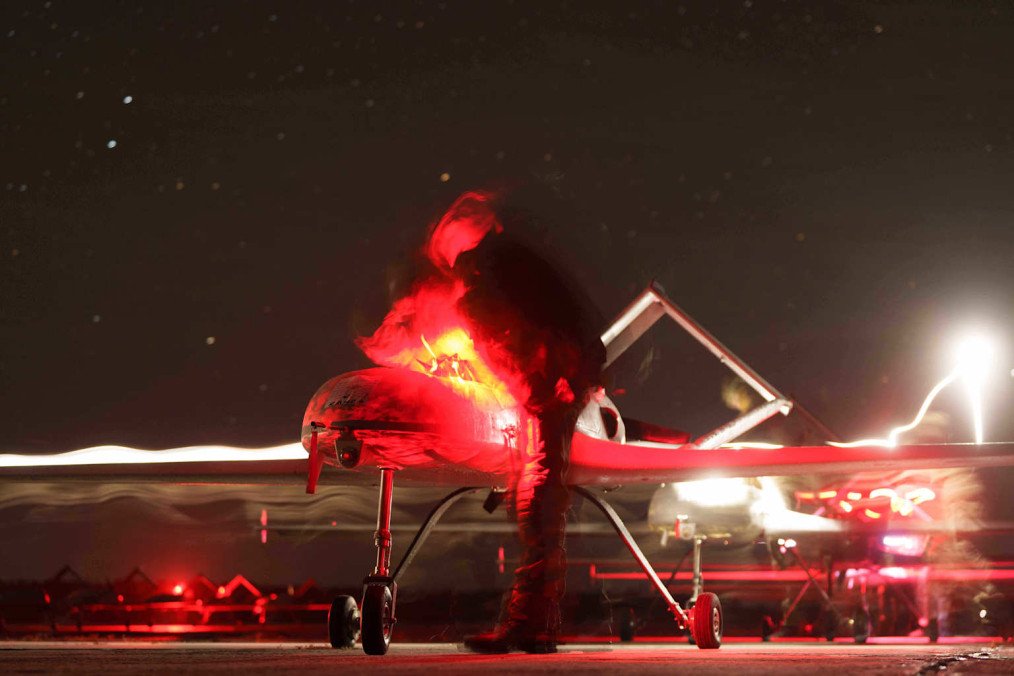A Ukrainian servicemember prepares a long-range attack drone for a nighttime mission.