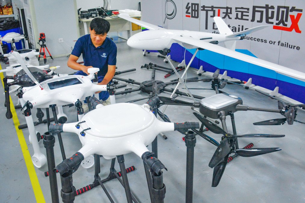 An employee works on the production line of drones at a workshop of an aerial technology company on July 9, 2025, in Anqing, Anhui Province of China. (Source: Getty Images)