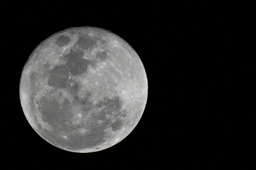 The full moon is seen over Caracas. (Source: Getty Images)