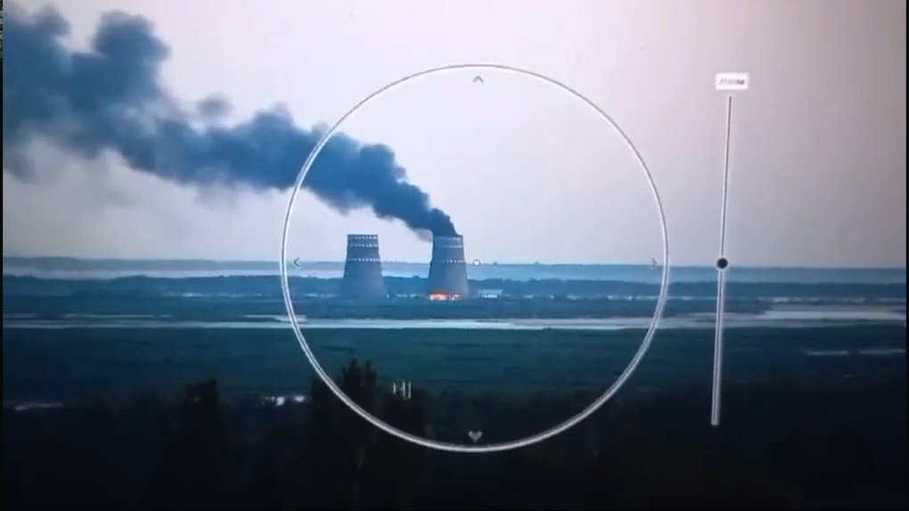 Smoke rises near the Zaporizhzhia Nuclear Power Plant, viewed through an optical device from across the Dnipro River. (Source: UNITED24 Media/YouTube)
