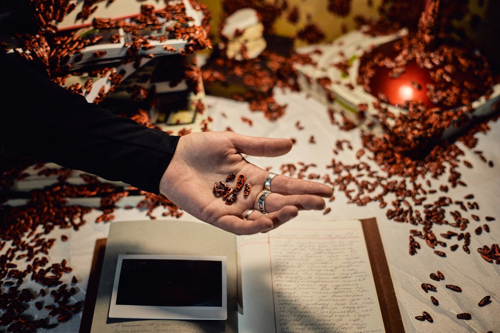 Olha Koval showing the hand-made firebugs of her installation displayed at the IMPACT KYIV forum. Kyiv, Ukraine. October 2026 (photo: Louis Beaudemont/UNITED24 Media)