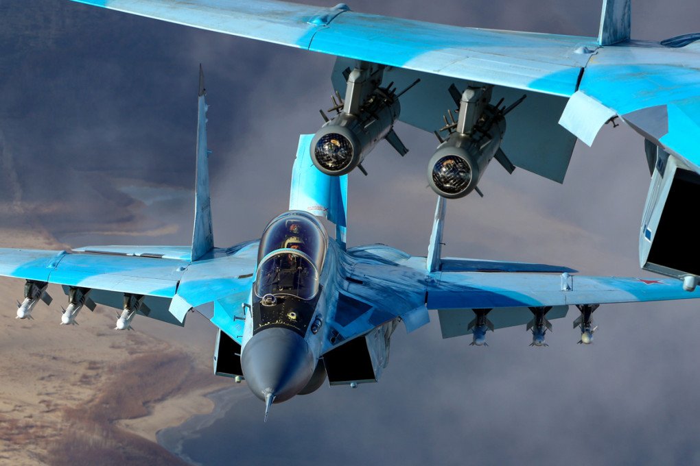 Two Russian MiG-35 fighter jets in the air. (Source: Wikimedia) Two Russian MiG-35 fighter jets in the air.